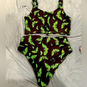 XL Zaful two piece in black with bat motif and knotted top.